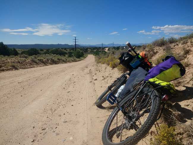 Trek 990 bikepacking on a dirt road